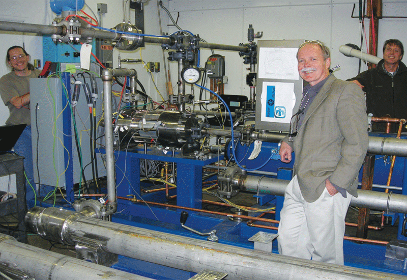 Steve Wright, foreground right, with an early test loop of a Brayton cycle turbine. Steve Wright, foreground right, with an early test loop of a Brayton cycle turbine.